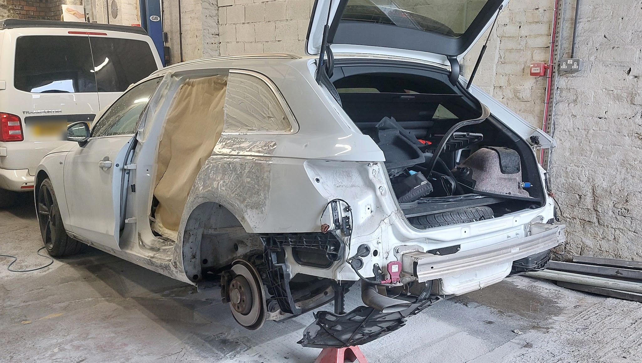 White Audi estate stripped back for rear quarter repair