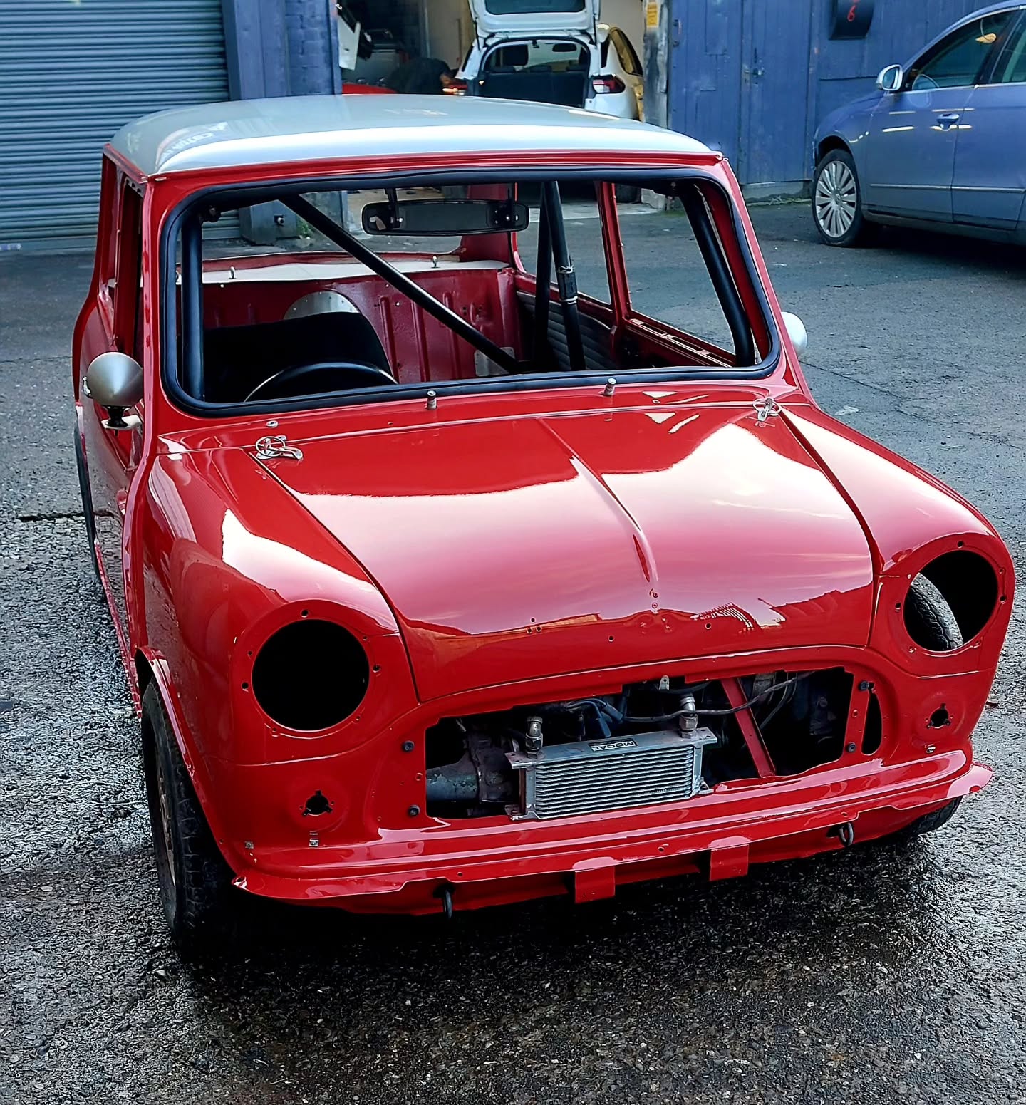 1964 Mk1 Morris Mini in fresh red paint with a white roof