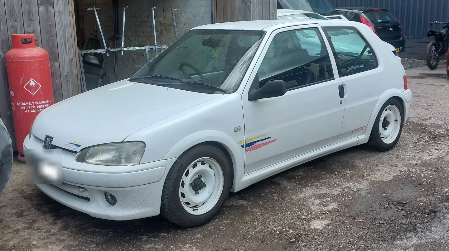 White Peugeot 106 Rallye on arrival at the workshop